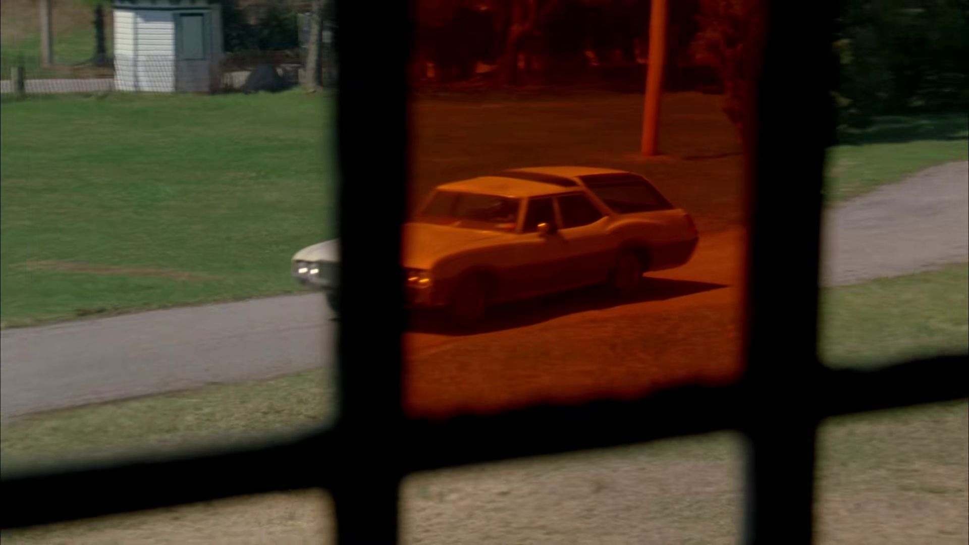 Connection: Peter's car through red glass